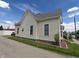 Charming home featuring a manicured lawn and neat landscaping at 152 1St W St, Shelbyville, IN 46176