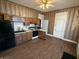 Spacious kitchen with wood cabinets, modern appliances, and hardwood floors at 152 1St W St, Shelbyville, IN 46176