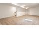 A finished basement featuring neutral carpet, white walls, and recessed lighting, complete with a staircase at 1520 Central Ave, Indianapolis, IN 46202