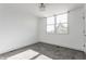 Bedroom featuring neutral carpet, a window, and a closet in a minimalist and modern design at 1520 Central Ave, Indianapolis, IN 46202