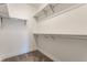 A walk-in closet features ample storage with shelving on the walls and neutral carpeted floor at 1520 Central Ave, Indianapolis, IN 46202