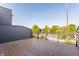 A spacious wood deck with metal railings offering outdoor living space and neighborhood views at 1520 Central Ave, Indianapolis, IN 46202