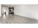 Open living area showcasing a kitchen with stainless steel appliances and dark cabinetry at 1520 Central Ave, Indianapolis, IN 46202