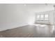 Open living room featuring large bright windows and modern gray flooring at 1520 Central Ave, Indianapolis, IN 46202