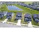 Wide angle aerial view of community featuring ponds and multiple single Gathering homes at 15413 Staffordshire Way, Fishers, IN 46037