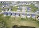 Wide angle aerial view of community with pond showcasing homes and landscaped yards at 15413 Staffordshire Way, Fishers, IN 46037