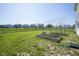 Backyard featuring raised garden beds and lawn space in a fenced residential area at 15413 Staffordshire Way, Fishers, IN 46037