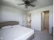 This carpeted bedroom features natural light, walk in closet and ensuite bathroom at 15413 Staffordshire Way, Fishers, IN 46037