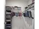 Walk-in closet with clothing racks and hanging storage and shelving for organization at 15413 Staffordshire Way, Fishers, IN 46037