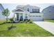 Charming two-story home with a manicured lawn and attached two-car garage at 15413 Staffordshire Way, Fishers, IN 46037