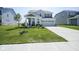 Charming two-story home with a manicured lawn and attached two-car garage at 15413 Staffordshire Way, Fishers, IN 46037