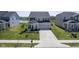 Charming home with a two-car garage, well-maintained lawn, and pond view at 15413 Staffordshire Way, Fishers, IN 46037