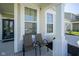 Cozy front porch featuring two chairs and ample natural light at 15413 Staffordshire Way, Fishers, IN 46037