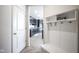 Inviting hallway with convenient storage and a view into the modern kitchen at 15413 Staffordshire Way, Fishers, IN 46037