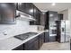Modern kitchen featuring stainless steel appliances and a gas range at 15413 Staffordshire Way, Fishers, IN 46037