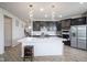 Well-appointed kitchen with a central island, stainless steel appliances, and modern finishes at 15413 Staffordshire Way, Fishers, IN 46037