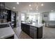 Spacious kitchen featuring a central island, stainless steel appliances, and modern lighting at 15413 Staffordshire Way, Fishers, IN 46037