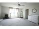 Spacious main bedroom features plush carpet, and en-suite bathroom at 15413 Staffordshire Way, Fishers, IN 46037
