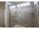 Beautifully tiled walk in shower with glass doors and rainfall shower head at 15413 Staffordshire Way, Fishers, IN 46037
