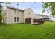 Beautiful backyard featuring lush grass, and a spacious wooden deck at 16001 Concert Way, Noblesville, IN 46060