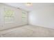 Bedroom with light walls, carpet, and large window at 16001 Concert Way, Noblesville, IN 46060