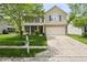 Charming two-story home with a well-manicured front yard and an attached two-car garage at 16001 Concert Way, Noblesville, IN 46060