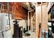 Unfinished basement with water heater, sump pump, and storage space at 16516 Wilsons Farm Dr, Fishers, IN 46040