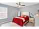 This bedroom features a neutral color palette, window, and ceiling fan at 16516 Wilsons Farm Dr, Fishers, IN 46040