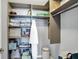 Custom closet with shelves and clothing rods offer ample storage space for an organized wardrobe and personal items at 16516 Wilsons Farm Dr, Fishers, IN 46040