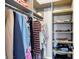 The walk-in closet has custom shelving, drawers, and ample space for storage at 16516 Wilsons Farm Dr, Fishers, IN 46040