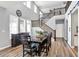 Dining room featuring a dark wood table and chairs next to a staircase with wooden banister and a buffet at 16516 Wilsons Farm Dr, Fishers, IN 46040
