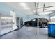 Garage with epoxy flooring, custom cabinets, and parking for vehicles at 16516 Wilsons Farm Dr, Fishers, IN 46040