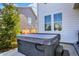 Backyard with a modern hot tub for relaxation and backyard views at 16516 Wilsons Farm Dr, Fishers, IN 46040