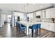 Spacious kitchen with white cabinets, a large island with seating, and stainless steel appliances, perfect for entertaining at 16516 Wilsons Farm Dr, Fishers, IN 46040