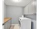 Efficient laundry room equipped with a washer, dryer, and storage cabinets offer convenience and functionality at 16516 Wilsons Farm Dr, Fishers, IN 46040