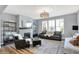 Inviting living room with gray walls, fireplace, area rug, and lots of natural light at 16516 Wilsons Farm Dr, Fishers, IN 46040