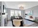 Bright living room with gray walls, fireplace, area rug, and stylish decor at 16516 Wilsons Farm Dr, Fishers, IN 46040