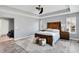 This spacious main bedroom features a tray ceiling, ceiling fan, and an ensuite bathroom at 16516 Wilsons Farm Dr, Fishers, IN 46040