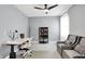 Well-lit home office with ample seating, a workspace, and a display case for trophies at 16516 Wilsons Farm Dr, Fishers, IN 46040