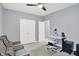 This home office offers a comfortable workspace with seating and neutral decor at 16516 Wilsons Farm Dr, Fishers, IN 46040