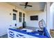 Inviting covered patio featuring stylish seating, fan, and open access to backyard at 16516 Wilsons Farm Dr, Fishers, IN 46040