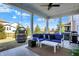 Relaxing covered patio with outdoor seating, fan and open view of the backyard at 16516 Wilsons Farm Dr, Fishers, IN 46040