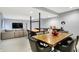 Open recreation room with dining area, bar, and comfortable seating with a large TV at 16516 Wilsons Farm Dr, Fishers, IN 46040