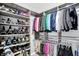 Organized walk-in closet with custom shelving for clothing and shoes at 16516 Wilsons Farm Dr, Fishers, IN 46040