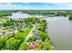 Breathtaking aerial shot of a community near a tranquil lake, surrounded by verdant greenery at 169 Bayview Dr, Cicero, IN 46034