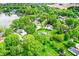 Aerial view of lakeside homes surrounded by lush greenery and expansive lawns at 169 Bayview Dr, Cicero, IN 46034