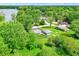 Aerial view of homes with landscaped yards situated near a lake surrounded by mature trees at 169 Bayview Dr, Cicero, IN 46034