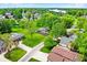 Aerial view of a charming neighborhood with lush greenery and a serene lake in the distance at 169 Bayview Dr, Cicero, IN 46034