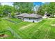 A spacious backyard features a lush lawn and modern exterior of the well-maintained home at 169 Bayview Dr, Cicero, IN 46034