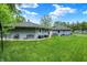 Spacious backyard featuring a lush lawn and patio, ideal for relaxation and recreation at 169 Bayview Dr, Cicero, IN 46034